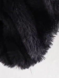 Close-up of the soft black faux fur texture on this stylish bomber jacket