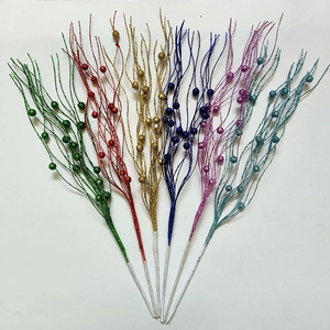 Detail showing colorful glitter berry stems for Christmas tree and party decoration