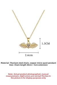 Macro view of gold heart pendant with wings showing micro-inlay zircon and dimensions
