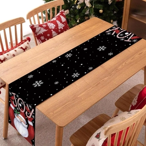 Christmas table runner featuring Santa Claus and candy cane patterns on a cozy festive table