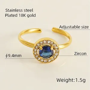 Adjustable 18K gold plated stainless steel ring featuring a round blue zircon halo