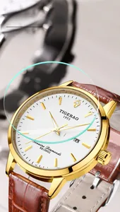 Macro shot of sapphire crystal dial with gold hour markers and day-date calendar display