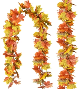 Detailed close-up of colorful artificial maple leaf garland for Thanksgiving autumn decor