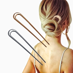 Minimalist metal U-shaped hair pins for women in rose gold and black finish shown on model