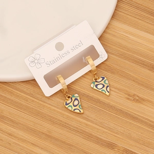 Detail of heart-shaped stainless steel earrings with colorful enamel oil drip patterns