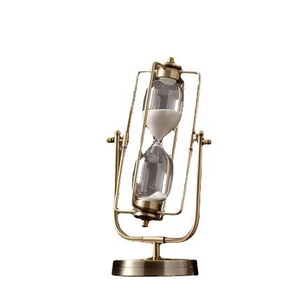 European vintage bronze rotating hourglass with white sand on a stable metal base