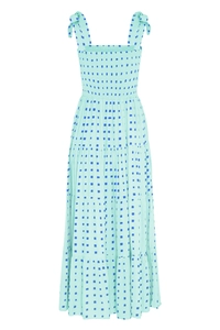 Detail of mint green sundress featuring blue square print and ruffled elastic bustier