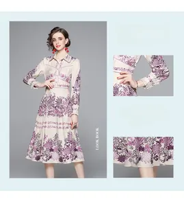 Detail of floral print maxi dress featuring ruffled cuffs and elegant waistline cut