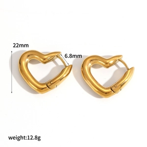 Gold chunky heart hoop earrings made of polished stainless steel with size specs
