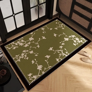 French vintage PVC leather doormat with olive green floral print on wood floor