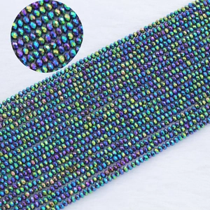 Macro detail of 2mm faceted crystal beads showing rainbow AB plating and metal luster