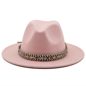 Detail of pink fedora wool hat featuring a colorful ethnic style woven decorative band