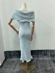 Detail of light blue knit dress back on mannequin showing slim fit and strapless design