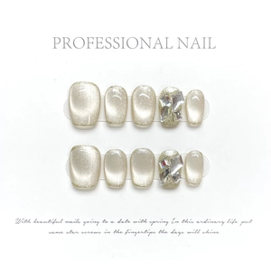 Short handmade champagne cat-eye press-on nails with sparkling gemstone accents