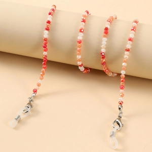 Macro shot of colorful faceted crystal beads on an eyewear chain with silver lobster clasps
