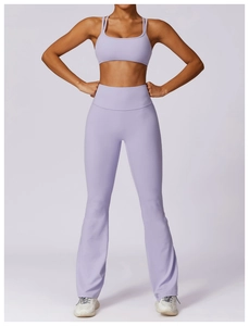Detail of high-waisted flared yoga pants and thin strap sports bra in lavender purple