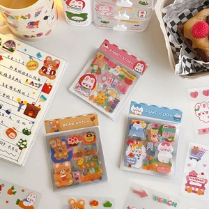 Close-up of cute cartoon rabbit and puppy stickers for DIY scrapbooking decoration