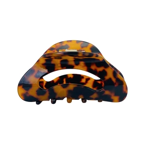 Minimalist tortoiseshell acetate crescent hair claw clip with cutout design and metal spring