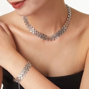Silver flower necklace and bracelet set with textured floral geometric links