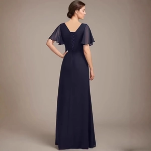 Elegant navy blue chiffon wedding guest gown with butterfly sleeves and open back detail