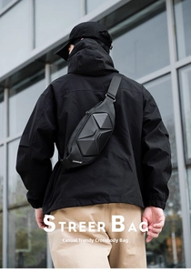 Detail of black hard shell crossbody bag with geometric 3D faceted design for men
