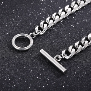 Macro shot of silver stainless steel Cuban link chain with classic OT toggle clasp design
