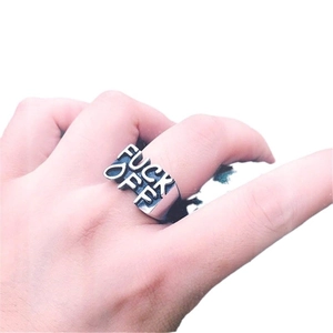 Silver punk style stainless steel ring featuring embossed FUCK OFF lettering on wide band