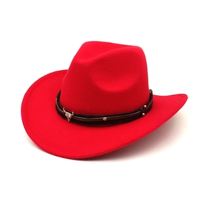 Detail of red cowboy hat with black braided band and silver bull head metal ornament