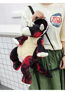 Detail of triceratops plush backpack with red and black tie-dye faux fur texture