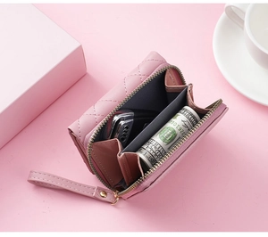 Internal view of pink quilted PU leather wallet showing compartments and zipper
