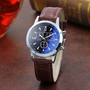 Detail of blue dial men's quartz watch with silver steel case and brown leather strap