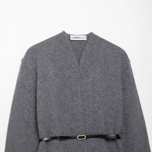 Gray V-neck knit wool coat for women with a slim black leather belt and golden buckle