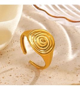 Close-up of 18K gold-plated stainless steel ring featuring a unique spiral swirl texture