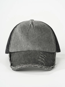 Detail of distressed baseball cap featuring raw edge fraying and vintage washed finish