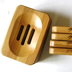 Eco-friendly bamboo soap dish with drainage holes and decorative bamboo leaf pattern