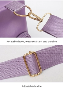 Detail of adjustable strap with gold-tone swivel hook and buckle on purple fitness bag