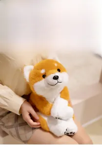 Close-up of soft orange and white plush Shiba Inu toy showing the realistic fur texture