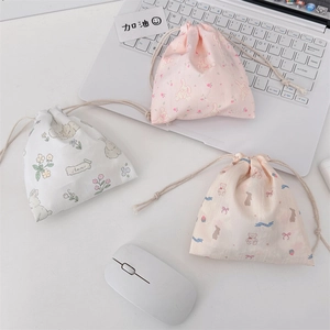 Three-piece cute drawstring pouches with rabbit and floral prints on cotton canvas