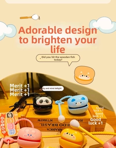 Close-up of animal-themed wooden fish keychain toys in four colors on a display stand