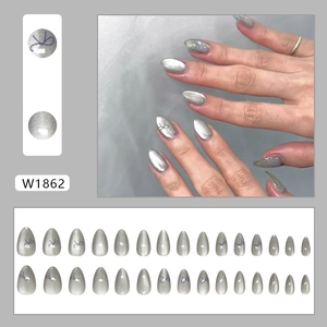 Silver cat eye press-on nails set with blue bow designs and shimmering finish