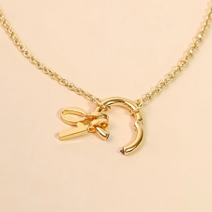 Elegant 18K gold plated minimalist knot pendant necklace with fine chain for women