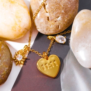 Gold MOM necklace with 11:11 engraved heart and zircon pendants on natural stones