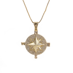 Gold compass pendant necklace with CZ stones and NSEW letters on a sleek box chain