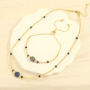 Bohemian gold necklace and bracelet set with blue sodalite beads on shell tray