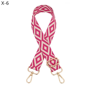 Detail of rose red and white diamond pattern woven strap with gold metal lobster clasps