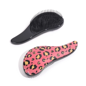 Set of black and pink leopard print hairbrushes for smooth detangling on white background