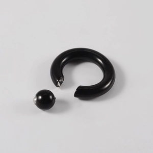 Detailed view of heavy-duty black captive bead ring with large metallic spring ball