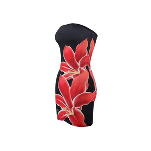 Detailed close-up of slim-fit strapless dress with vibrant red floral print on black fabric