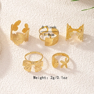 Detailed view of a gold leaf ring set showing 1.8cm diameter and 2g weight specs