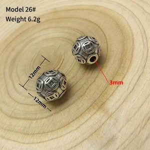 Detail of 12mm vintage hollow silver beads with ancient coin patterns for DIY jewelry